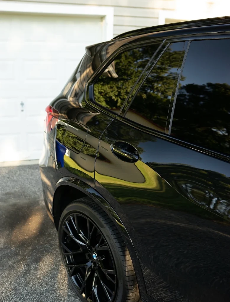 Deep reflections on a ceramic coated black BMW X5 M
